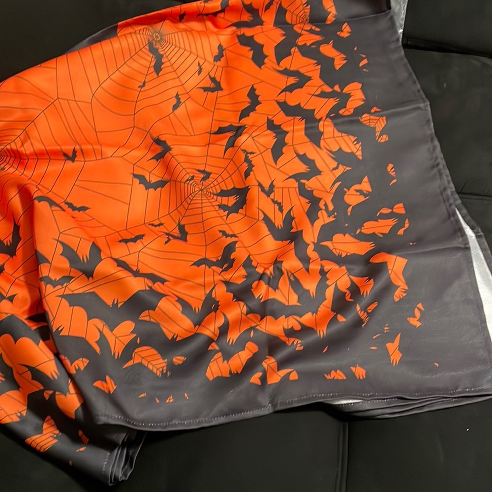 This SPOOY TABLE CLOTH measures 80x120” large for big tables. 100% polyester.